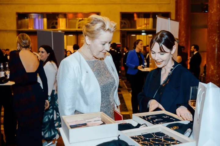 Guests looking at products on a showcase table
