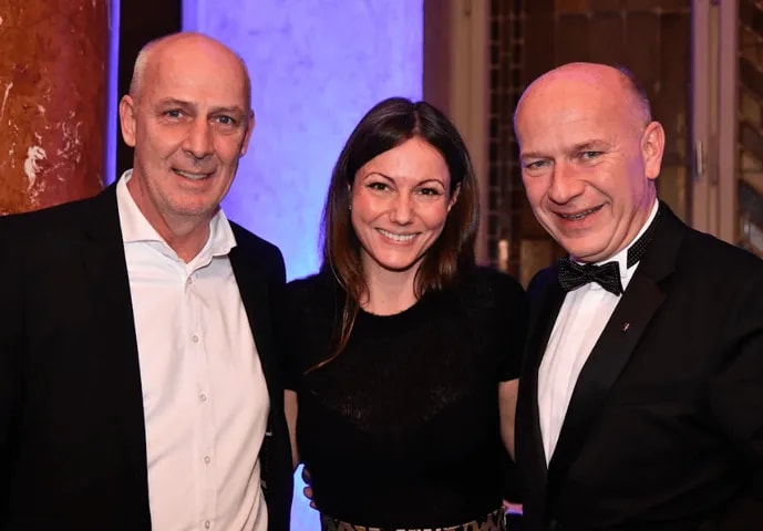Three guests smiling for the camera