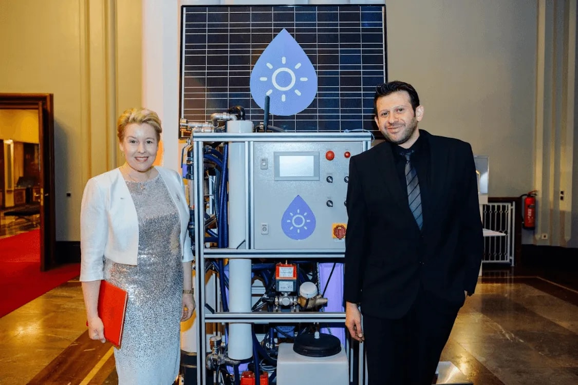 Guests next to a partner’s water technology demo at the Gala